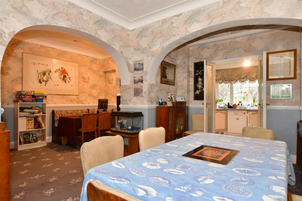 Dining area looking towards kitchen and alcove